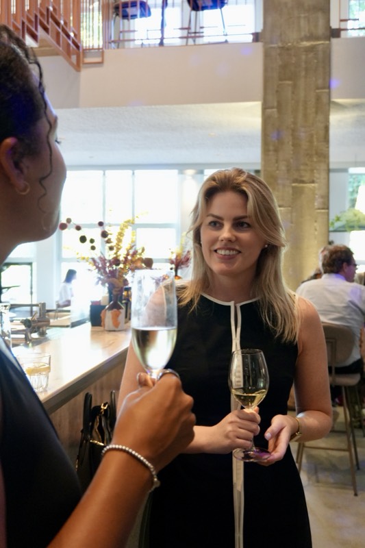Guests with champagne at the bar